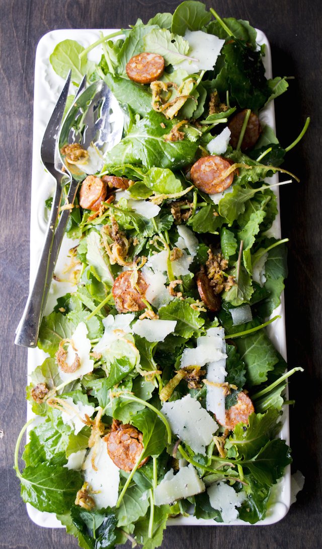 Baby Kale Salad with Spanish Chorizo, Manchego Cheese, Crispy Leeks and a Mustard Shallot Vinaigrette